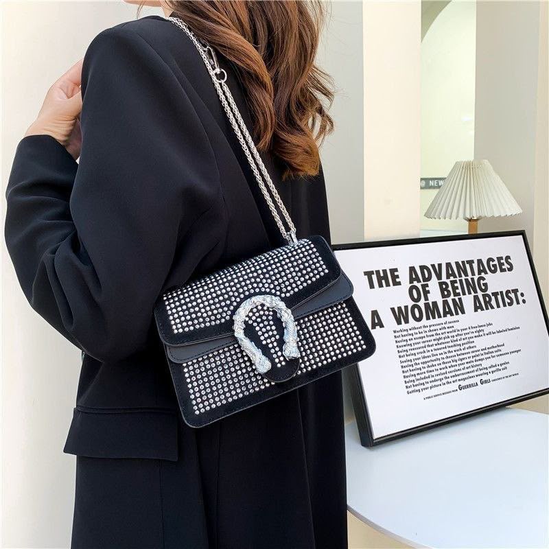 Crystal-Embellished Suede Shoulder Bag with Horseshoe Buckle