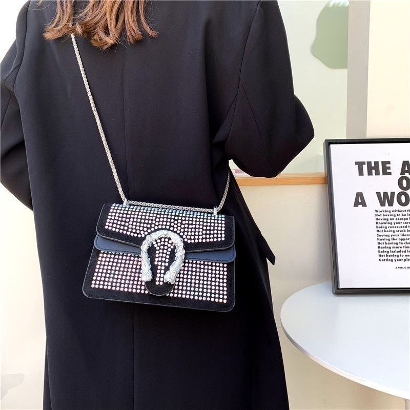Crystal-Embellished Suede Shoulder Bag with Horseshoe Buckle