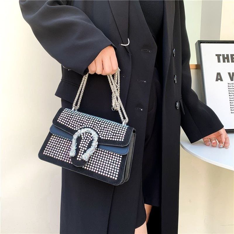 Crystal-Embellished Suede Shoulder Bag with Horseshoe Buckle